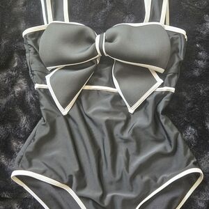 Black One-Piece Swimsuit with White Trim and Decorative Bow